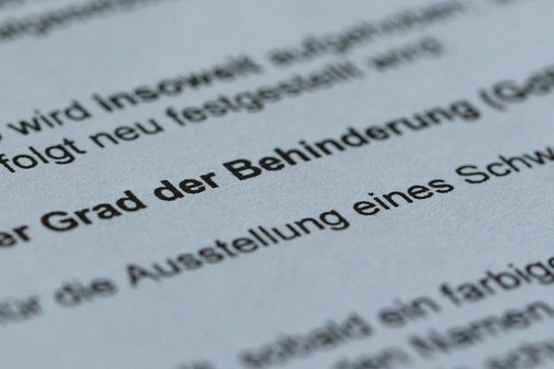 Ausschnitt aus einem Feststellungsbescheid, in dem der Grad der Behinderung mitgeteilt wird. 
